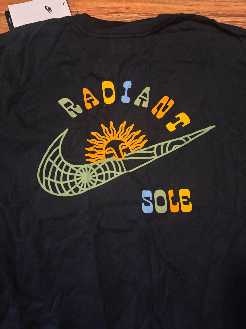 Nike Black Tee with 'Radiant Sole' Graphic
